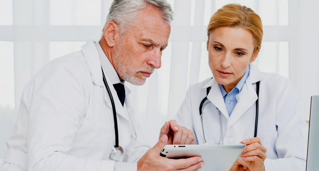 A man and a woman using EHR